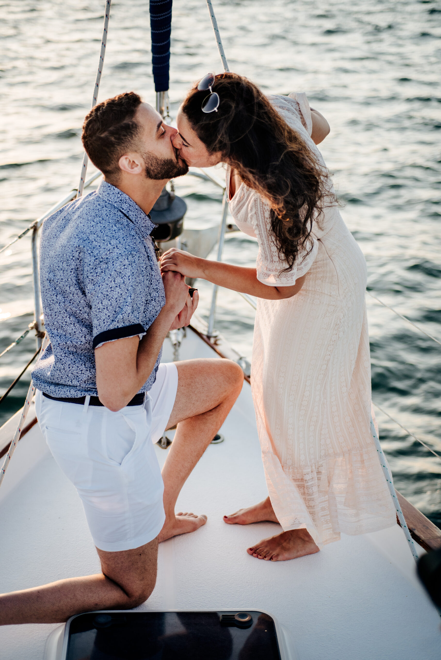 Couple onboard St. Pete Sailing Charters day sail - sailboat proposal photoshoot