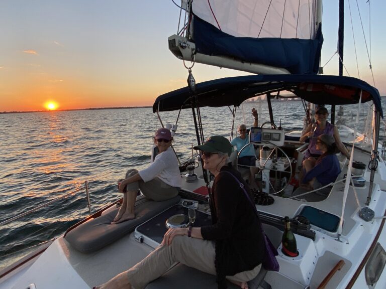 Guests enjoying a private sunset sail on Satori in St. Petersburg