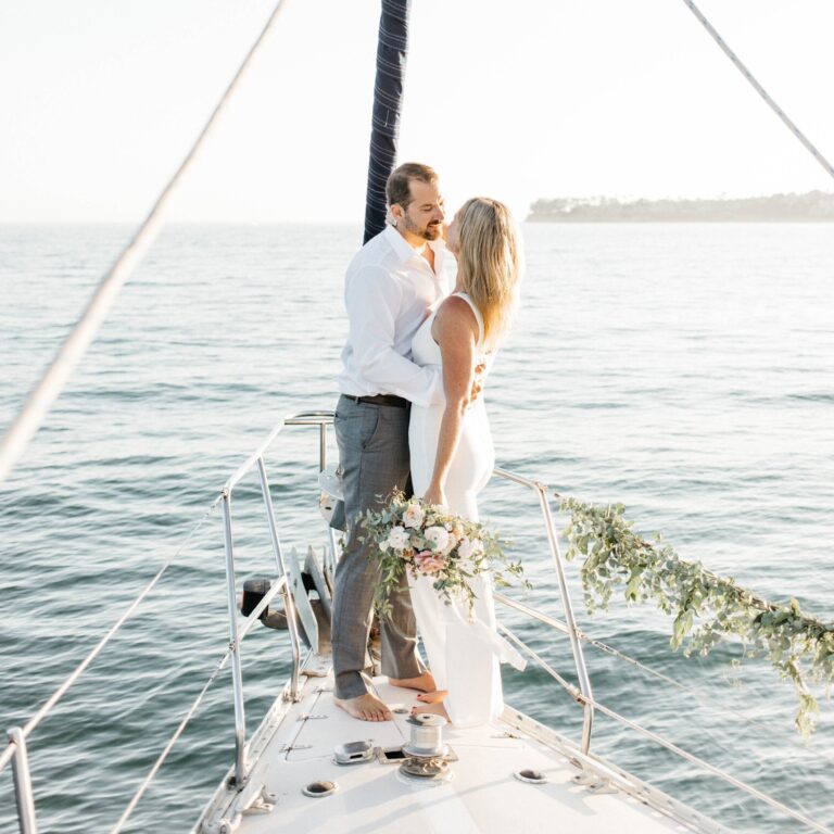 Sailboat wedding couple standing on deck in St. Petersburg