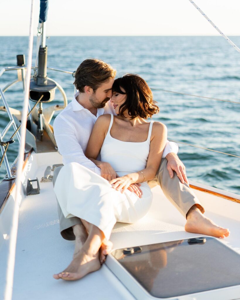 Couple sitting together during a sailboat photoshoot in St. Petersburg