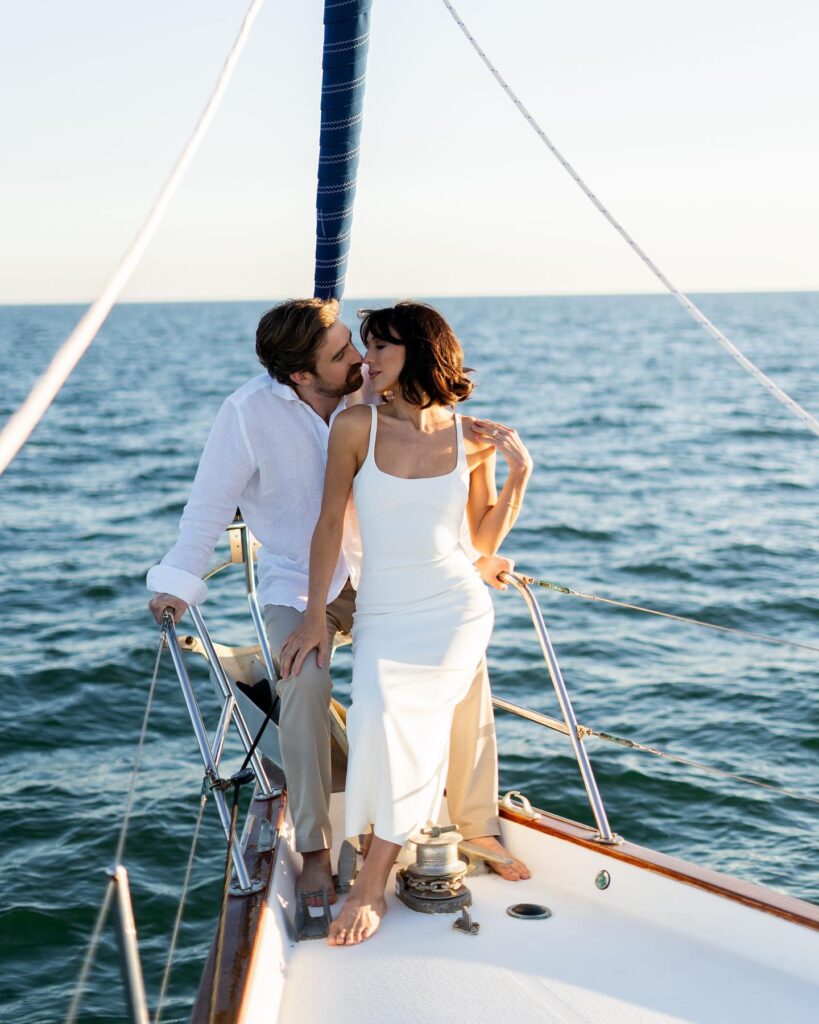 Couple posing on a sailboat during a St. Petersburg photoshoot