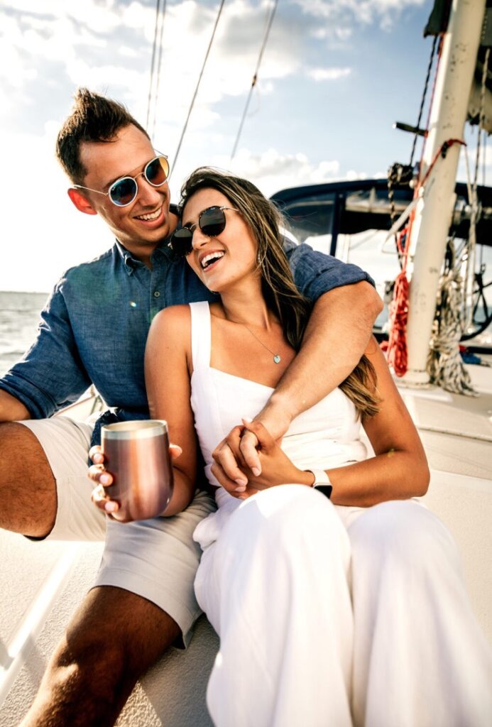Couple photographed aboard a private sailboat in St. Petersburg