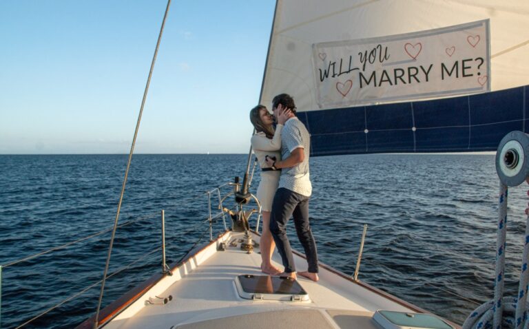 Couple celebrating a proposal on a private sail in St. Pete